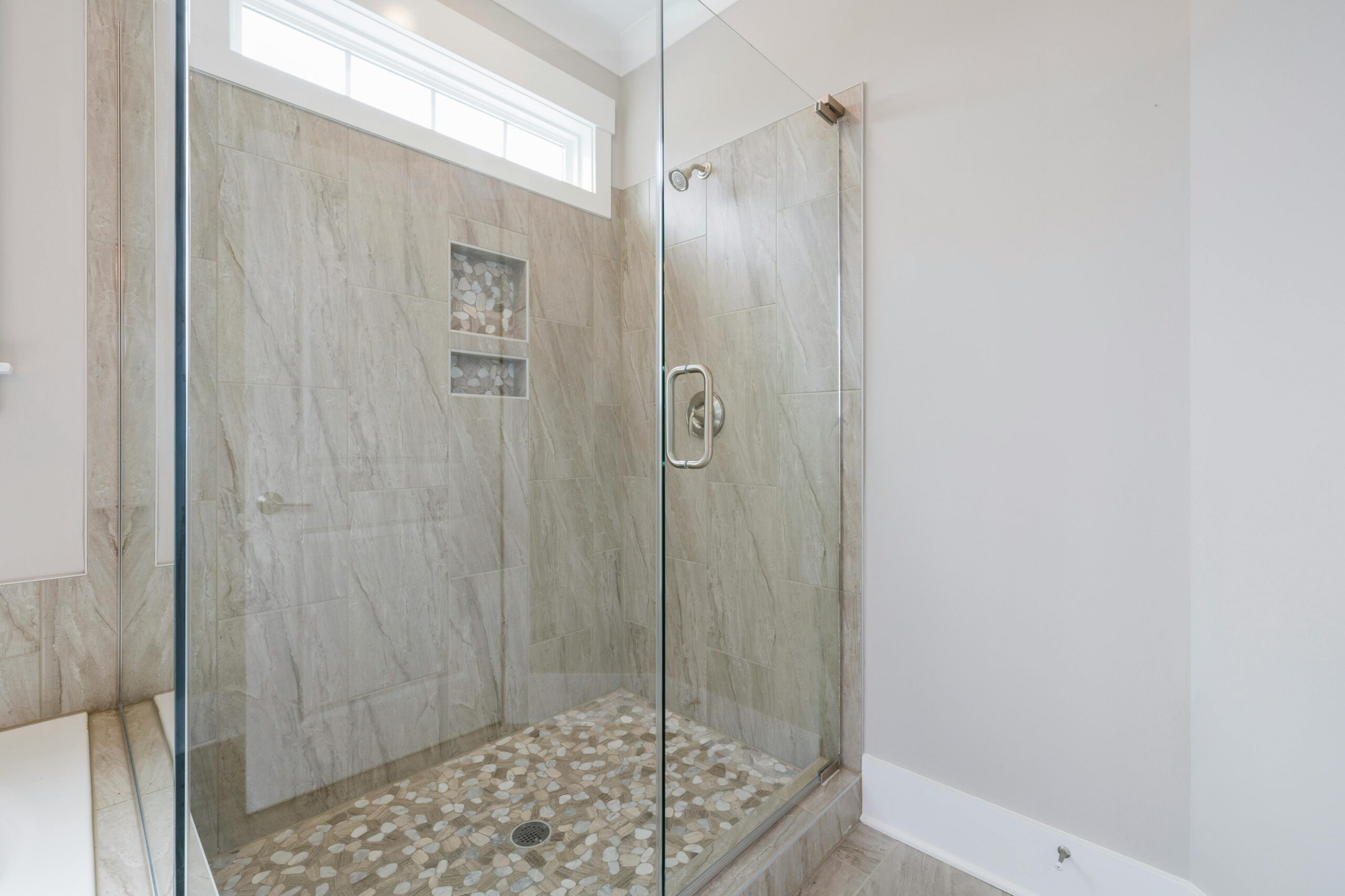 Shower with marble walls in modern bathroom
